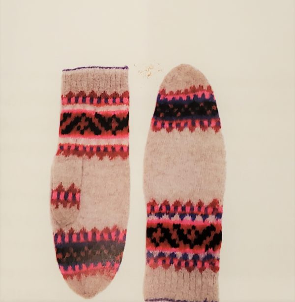 Off-white mittens with colorwork bands of pink, purple, black and red.